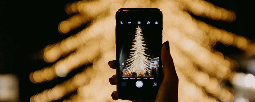 Taking a photo of a Christmas Tree for holiday marketing